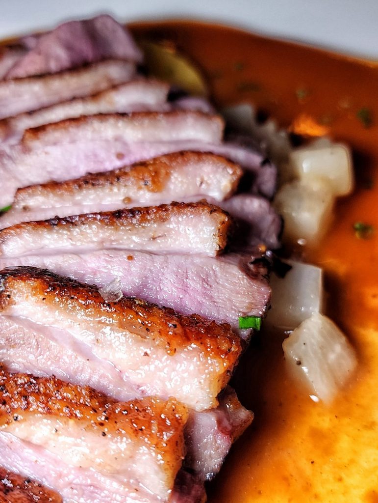 Le Rivage CANARD À L'ORANGE roasted duck up close