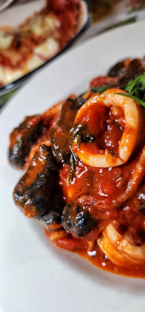 Frank squid ink gnocchi with calamari up close